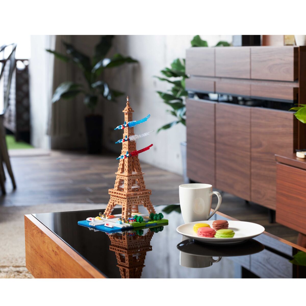 nanoblock Eiffel Tower on a desk beside a coffee cup