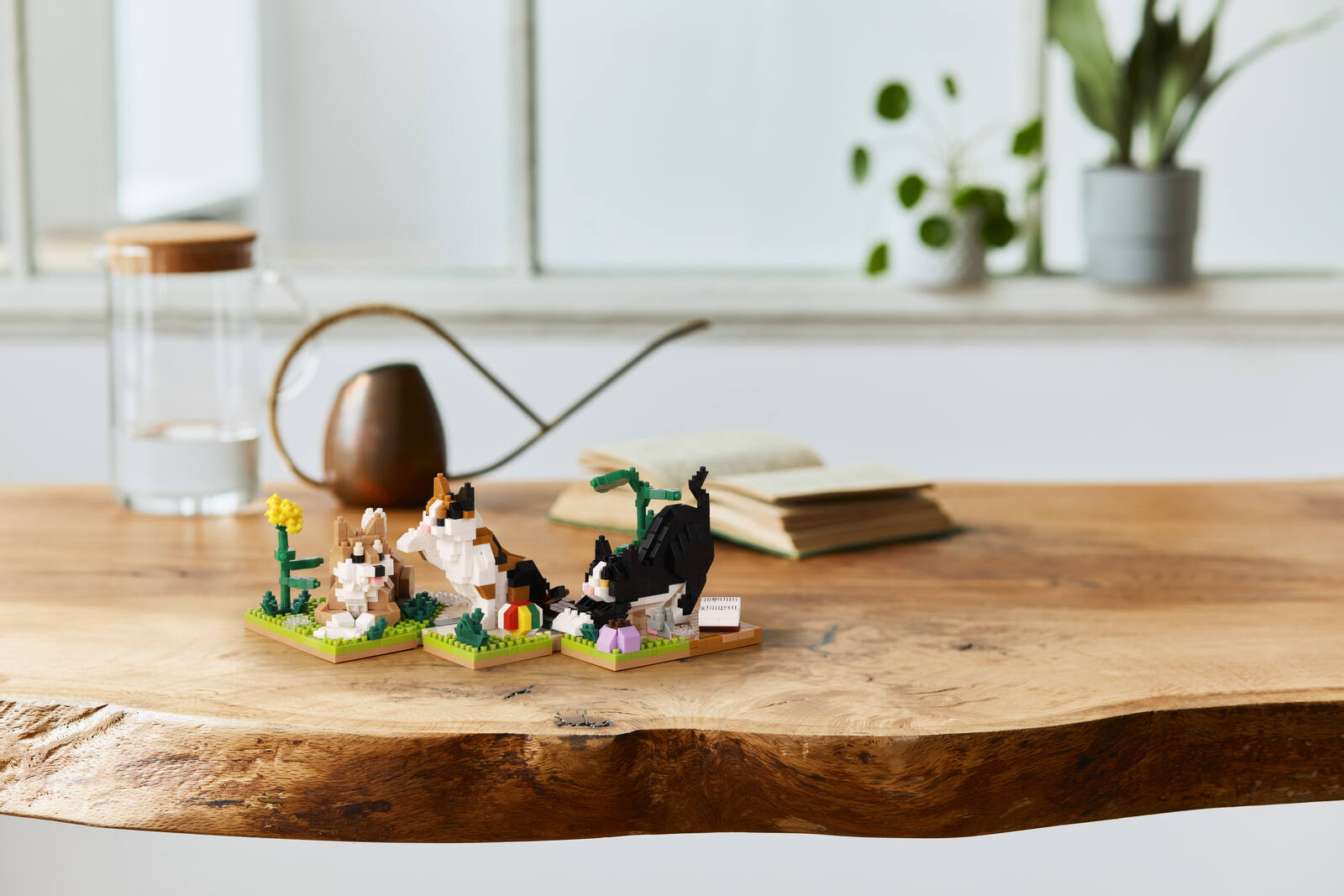 nanoblock corgi and cat models on a wooden bench