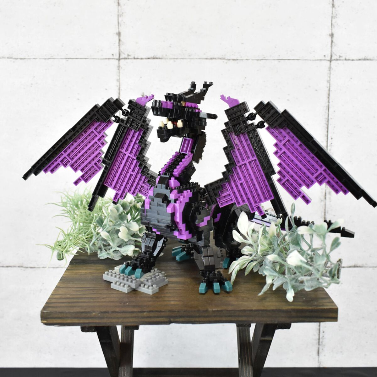 nanoblock purple dragon on a garden table
